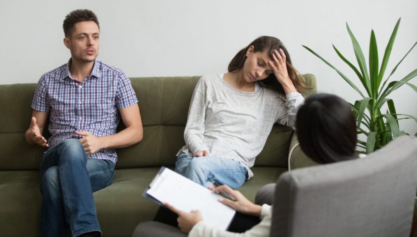 Couple receiving psychological help from expert